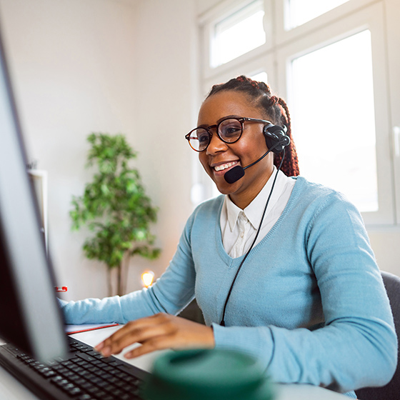 Customer support specialist working at her office.