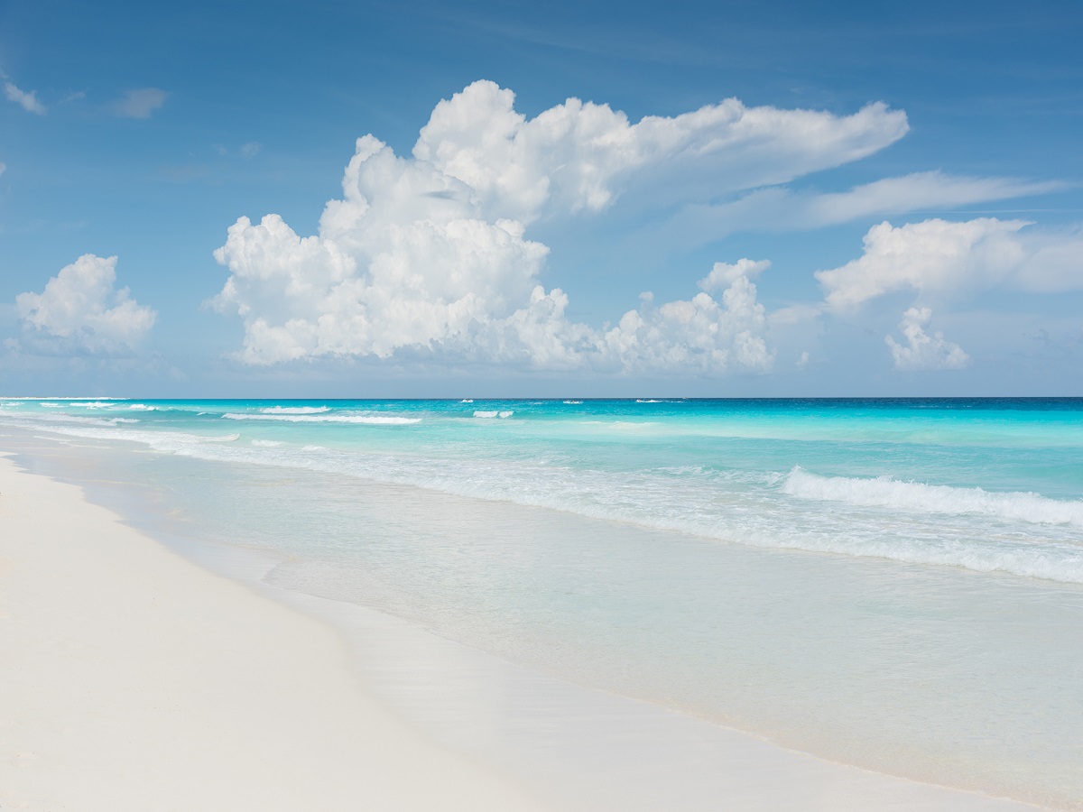 681925820 Beautiful turquoise caribbean water with gentle waves and white sandy beach on a beautiful sunny day in Mexico.. Cancun, Mexico, Central America.
