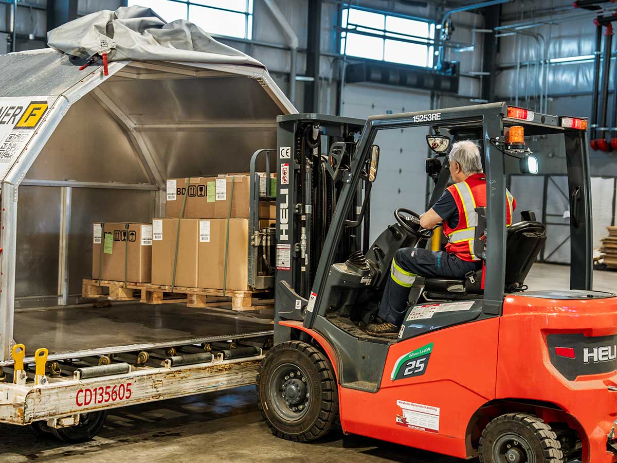 Worker filling cargo container