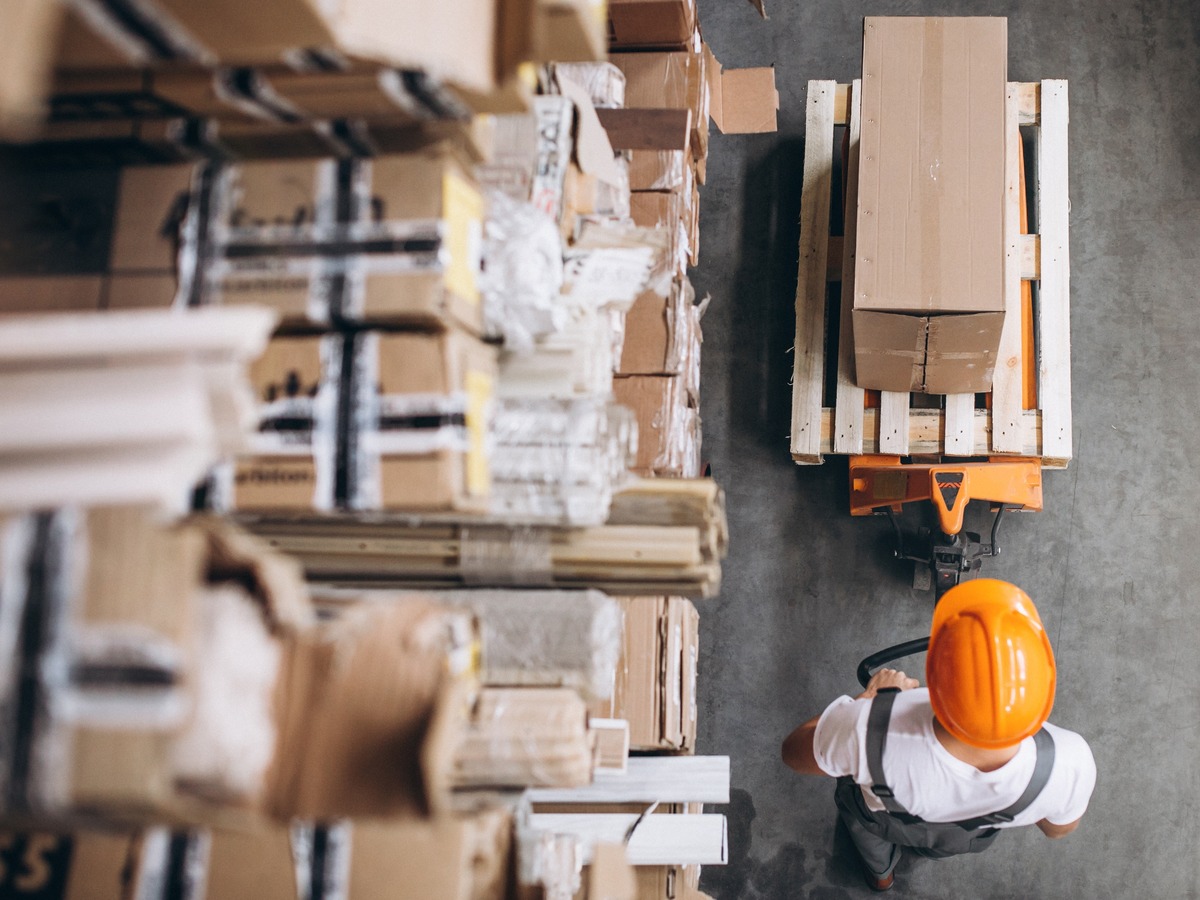 Warehouse worker stacking boxes